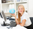 Portrait of a cute business woman with a world globe, sitting at