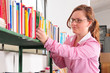 Teacher selecting a story