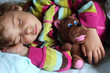 little girl sleeps in train with puppet little girl sleeps in train with puppet