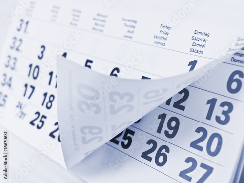 Photo: Close up a blue toned calendar page Close up a blue toned calendar page