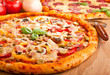 two pizzas on a table