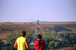 Two guys compete on radio controlled helicopter Two guys compete on radio controlled helicopter