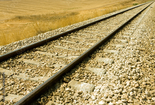 Photo: Railroad tracks curving off into the rural fields Railroad tracks curving off into the rural fields