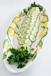 Whole poached salmon with cucumber and watercress