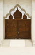 Beautiful wooden gate to a holy temple in India