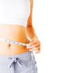 Photo: Young Woman Measuring Herself On White Young Woman Measuring Herself On White