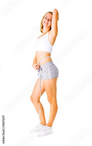 Photo: Young Woman Measuring Herself On White Young Woman Measuring Herself On White