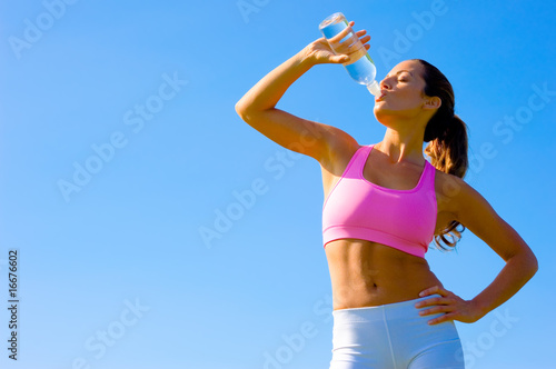 Photo: Athletic Woman Exercising Athletic Woman Exercising