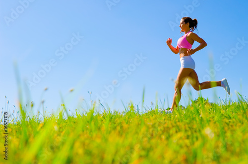 Photo: Athletic Woman Exercising Athletic Woman Exercising