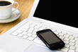 White laptop and coffee cup