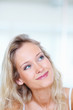 Closeup of a cute young girl smiling, looking upwards