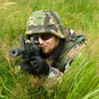 Sniper laying in a grass Sniper laying in a grass
