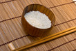 bowl with rice on mat with sticks bowl with rice on mat with sticks