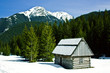 A wooden hut/shelter in snowy mountains A wooden hut/shelter in snowy mountains