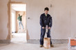 Man mixing plaster in house under construction