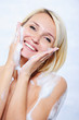 Happy woman relaxing in bathroom
