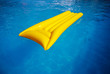 yellow mattress in the swimming pool