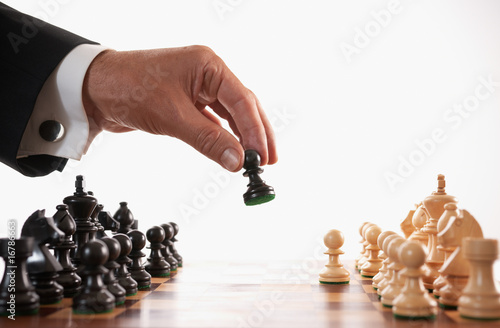 Photo: businessman playing chess game selective focus businessman playing chess game selective focus