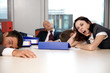 Young business team exhausted and over worked
