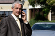 Portrait of handsome mature businessman on cell phone