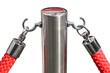 Close-up of red velvet rope and a silver pole