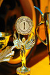 Trophies for winner and yellow wheel of racing car