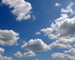 Seamless time lapse clouds over blue sky - PAL