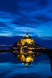 Mont St. Michel reflected in the sea at night