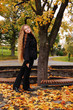 Young girl in autumn park