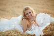 Photo: Bride in hay stack Bride in hay stack