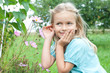 young girl listening to a flower young girl listening to a flower