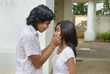 Photo: Boy pinching girl's cheeks Boy pinching girl's cheeks