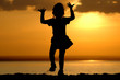 Silhouette of dancing girl on sundown Silhouette of dancing girl on sundown