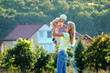 Happy mother keeps small girl on hand Happy mother keeps small girl on hand