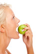 Closeup of a girl biting an apple