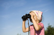 Young girl with binoculars Young girl with binoculars