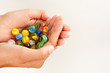 Cupped Hands Holding Lots of Marbles