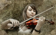 Beautiful female violinist playing violin on the grunge backgrou