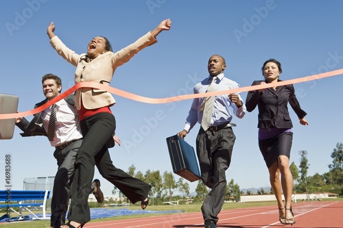 Photo: Business People Crossing the Winning Line Business People Crossing the Winning Line