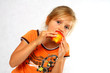 Girl eating a fruit
