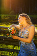 Beautiful woman with a bunch of flowers.