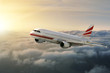 Airplane in the sky at sunset
