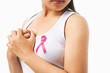 Pink badge on woman chest to support breat cancer cause