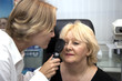 doctor,examining a patient in ophthalmology laboratory