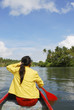 Woman in canoe paddling