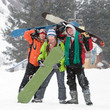 Photo: Healthy lifestyle image of happy snowboarders team, .Snowfall Healthy lifestyle image of happy snowboarders team, .Snowfall