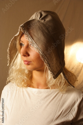 Photo: a woman with a bonnet a woman with a bonnet