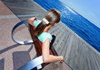 blonde girl relaxing in chair at seaside