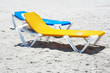 Photo: A couple of beach chairs in a deserted beach A couple of beach chairs in a deserted beach
