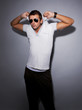 Photo: young man in casual trendy clothes young man in casual trendy clothes